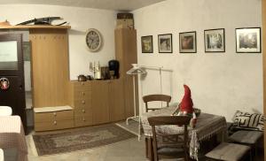 a living room with a table with a santa hat on it at Vilijev Raj, a property with cottage in the countryside in Avče
