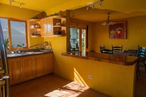 a kitchen with a sink and a counter in a room at Casa Maria Vista, Espectacular View in Santa Cruz La Laguna