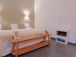 a bedroom with a bed and a fireplace at Villa Morena in Finestrat