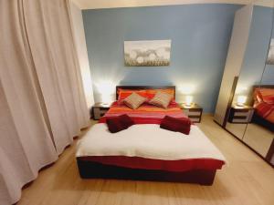 Posteľ alebo postele v izbe v ubytovaní Colour House