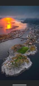 an aerial view of an island in the water at Ny leilighet i Henningsvær! in Henningsvær