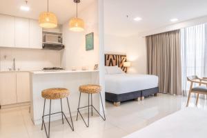 Lova arba lovos apgyvendinimo įstaigoje Origen Local Suites