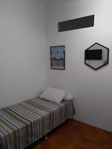 Кровать или кровати в номере Cantinho em Santa Teresa com bichinho de estimaçao