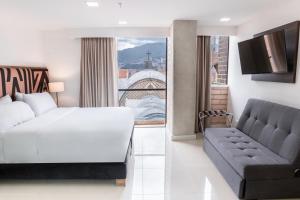 Lova arba lovos apgyvendinimo įstaigoje Origen Local Suites