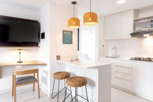 Virtuvė arba virtuvėlė apgyvendinimo įstaigoje Origen Local Suites