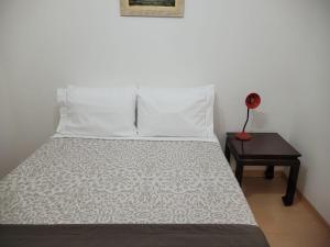 Säng eller sängar i ett rum på Flat Manhattan Residence Service