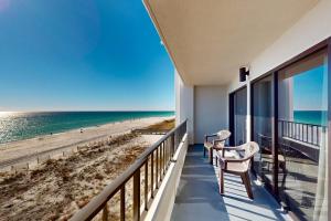 a balcony with a view of the beach at Surf Dweller 509 in Fort Walton Beach