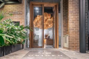 Fasadas ar įėjimas į apgyvendinimo įstaigą Origen Local Suites