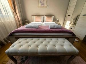 Postel nebo postele na pokoji v ubytování Infinity Boutique Apartments