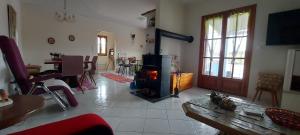 a living room with a wood stove in a room at Villa Zahner in Pitsidia
