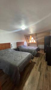 Llit o llits en una habitació de Cabaña Alpina