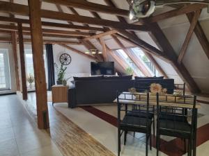 a living room with a couch and a table at Ferienwohnung Haus Madlen in Kirschau