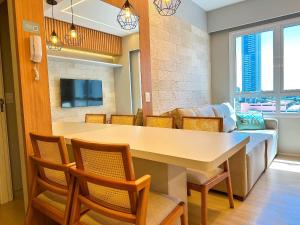 a dining room with a large table and chairs at STAY Blend SmartStyle in Goiânia