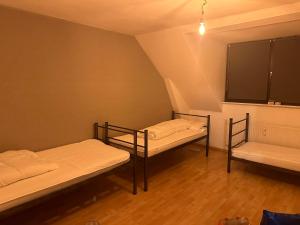 Voodi või voodid majutusasutuse Pauli Hostel toas