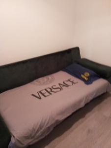 a bed with the word revealed written on it at Apartman Old Town in Stolac