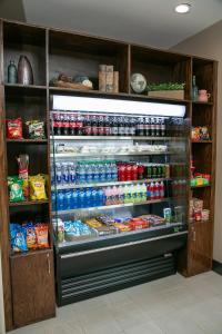 a refrigerator filled with lots of food and drinks at Holiday Inn Metairie New Orleans, an IHG Hotel in Metairie