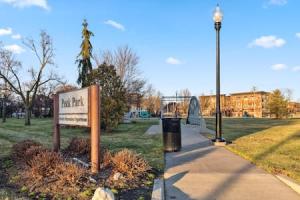 a park with a sign and a street light at Affordable 1-BR by DMC Detroit in Detroit