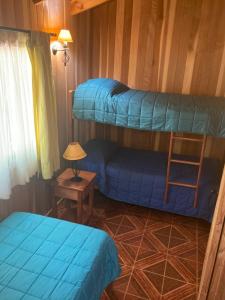 Postel nebo postele na pokoji v ubytování Los arrayanes de huife