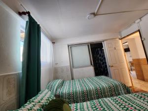 Postel nebo postele na pokoji v ubytování HOSTAL SOL ATACAMA -CALDERA