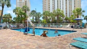 a child playing in a pool at a resort at Pelican Pointe Clearwater Beach Hotel in Clearwater Beach +26 photos