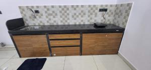a kitchen counter with a sink and a phone at 508 SD Zanita Heights in Vasco Da Gama