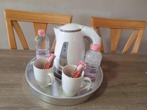 Coffee and tea making facilities at Bella Apartman