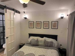 a bedroom with a bed and a ceiling fan at Beautiful farmhouse in Fernandina Beach in Fernandina Beach