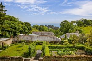an old farm with a garden and buildings at Little Redlap - Delightful views near Dartmouth in Dartmouth