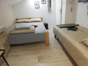 Voodi või voodid majutusasutuse Blue Carpet Rooms toas