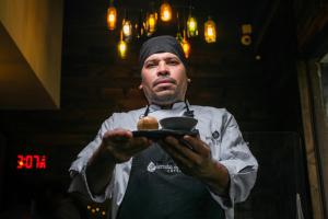 a man holding a plate of food in his hands at Hotel Termales del Ruiz in Manizales +73 photos