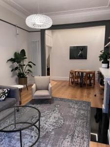 a living room with a couch and a table at Kemp Town apartment in Brighton & Hove