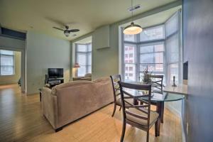a living room with a couch and a glass table at Chase Apartments Light St Convention Center FREE PARKING in Baltimore