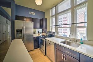 a kitchen with a stainless steel refrigerator and a sink at Chase Apartments Light St Convention Center FREE PARKING in Baltimore