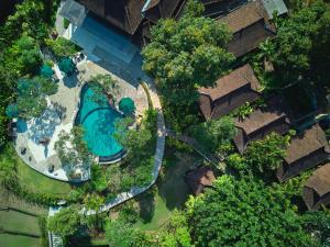 an overhead view of a swimming pool in a resort at The Damai in Lovina +63 photos