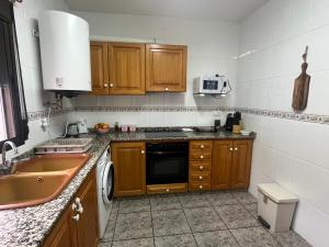 Kuchyň nebo kuchyňský kout v ubytování Apartamento La Ermita