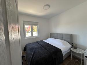 Postel nebo postele na pokoji v ubytování Apartman Mountain pine