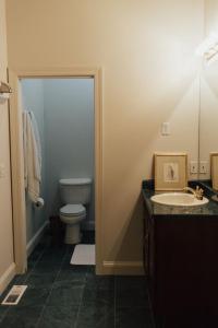 a bathroom with a toilet and a sink at Upscale, family friendly condo in Billings