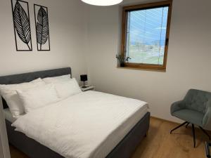 Postel nebo postele na pokoji v ubytování Apartmány Kamenec
