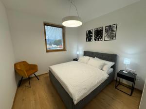 Postel nebo postele na pokoji v ubytování Apartmány Kamenec