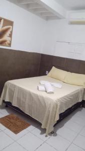 Tempat tidur dalam kamar di Pousada Manaíra Buena Playa