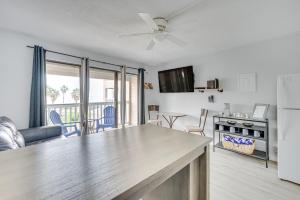 a kitchen and living room with a large counter top at Corpus Christi Condo Pool and Access to North Beach in Corpus Christi