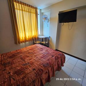 TV a/nebo společenská místnost v ubytování Hostal La Cascada