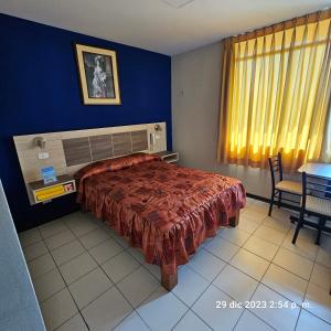 Postel nebo postele na pokoji v ubytování Hostal La Cascada