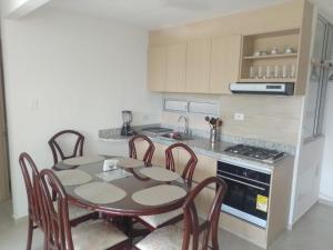 A kitchen or kitchenette at APARTAMENTO MELGAR - ALTAGRACIA