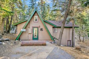 a small house with a green door in the woods at Whispering Woods Big Bear~ Central Resort Cottage~ in Big Bear Lake
