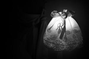 a black and white photo of a light with a wedding dress at Casa Vecia in Brtonigla