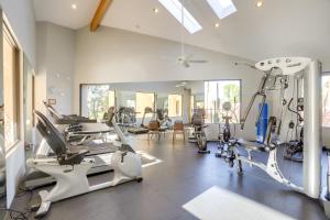 a gym with treadmills and machines in a room at Cathedral City Condo with Community Pools and Hot Tubs in Cathedral City