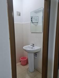 a bathroom with a sink and a mirror at appart near the Airport and beach tanger in Tangier +21 photos