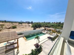 a view of a swimming pool from the balcony of a house at Pool Condo, just a few steps from the beach -north in Los Barriles
