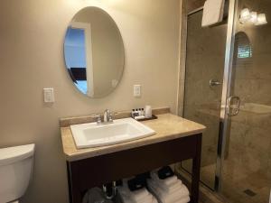 a bathroom with a sink and a shower at The Water Street Inn in Ephraim